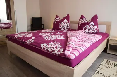 Ein Bett oder Betten in einem Zimmer der Unterkunft Apartmenthaus Frauenpreiss FeWo 52