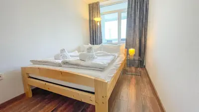 Ein Bett oder Betten in einem Zimmer der Unterkunft Frische Brise FeWo 06.10