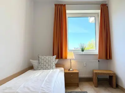 Ein Bett oder Betten in einem Zimmer der Unterkunft Haus am Waldbad Whg. 12/7