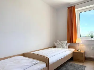 Ein Bett oder Betten in einem Zimmer der Unterkunft Haus am Waldbad Whg. 14/5