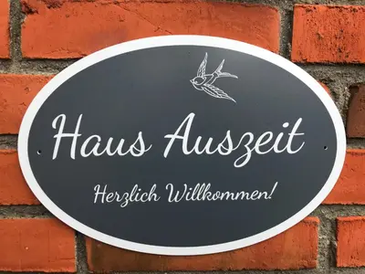 Ein Zertifikat, Auszeichnung, Logo oder anderes Dokument, das in der Unterkunft Ferienhaus Auszeit ausgestellt ist