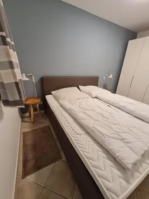 Ein Bett oder Betten in einem Zimmer der Unterkunft Nautilus, Ferienwohnung 5 inkl Strandkorb