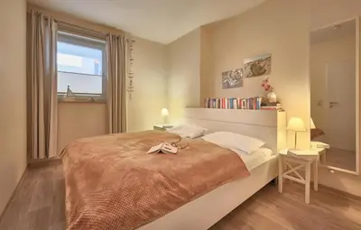 Ein Bett oder Betten in einem Zimmer der Unterkunft Nautilus, Ferienwohnung 13 inkl Strandkorb