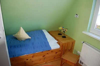 Ein Bett oder Betten in einem Zimmer der Unterkunft Christian-Brütt-Weg 42
