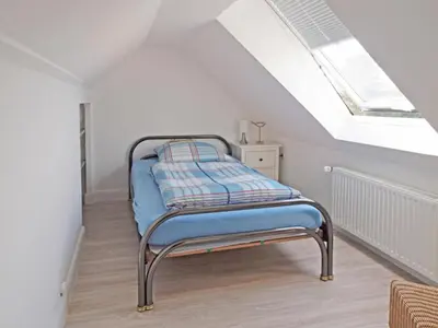 Ein Bett oder Betten in einem Zimmer der Unterkunft Haus Strandkrabbe, Seemöwe