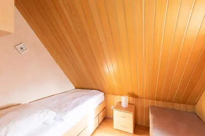 Ein Bett oder Betten in einem Zimmer der Unterkunft Wittdün