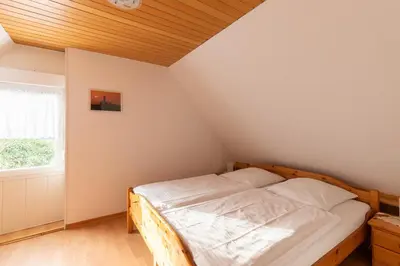 Ein Bett oder Betten in einem Zimmer der Unterkunft Wittdün