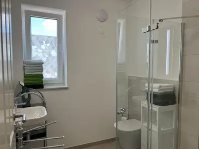 Ein Badezimmer in der Unterkunft Ferienwohnungen EBBE und FLUT - Niedrigenergiehaus