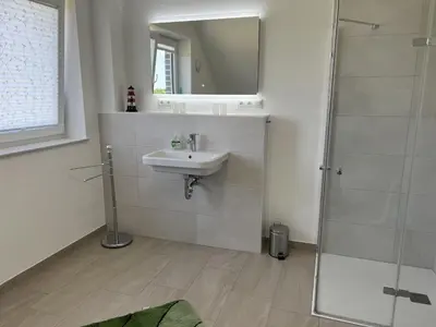 Ein Badezimmer in der Unterkunft Ferienwohnungen EBBE und FLUT - Niedrigenergiehaus