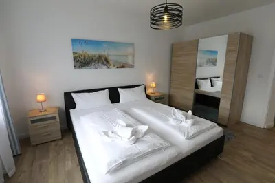 Ein Bett oder Betten in einem Zimmer der Unterkunft Rugenbargsweg 27 Whg 2