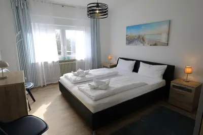 Ein Bett oder Betten in einem Zimmer der Unterkunft Rugenbargsweg 27 Whg 2