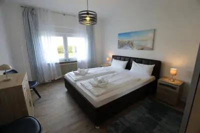 Ein Bett oder Betten in einem Zimmer der Unterkunft Rugenbargsweg 27 Whg 1