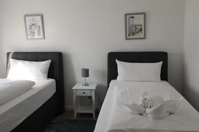 Ein Bett oder Betten in einem Zimmer der Unterkunft Rugenbargsweg 27 Whg 1