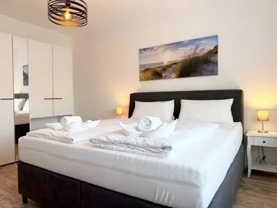 Ein Bett oder Betten in einem Zimmer der Unterkunft Rugenbargsweg 29 Whg 1