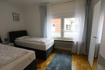 Ein Bett oder Betten in einem Zimmer der Unterkunft Rugenbargsweg 29 Whg 1