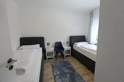 Ein Bett oder Betten in einem Zimmer der Unterkunft Rugenbargsweg 29 Whg 2
