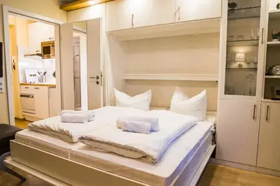 Ein Bett oder Betten in einem Zimmer der Unterkunft Haus Horizont HZ02